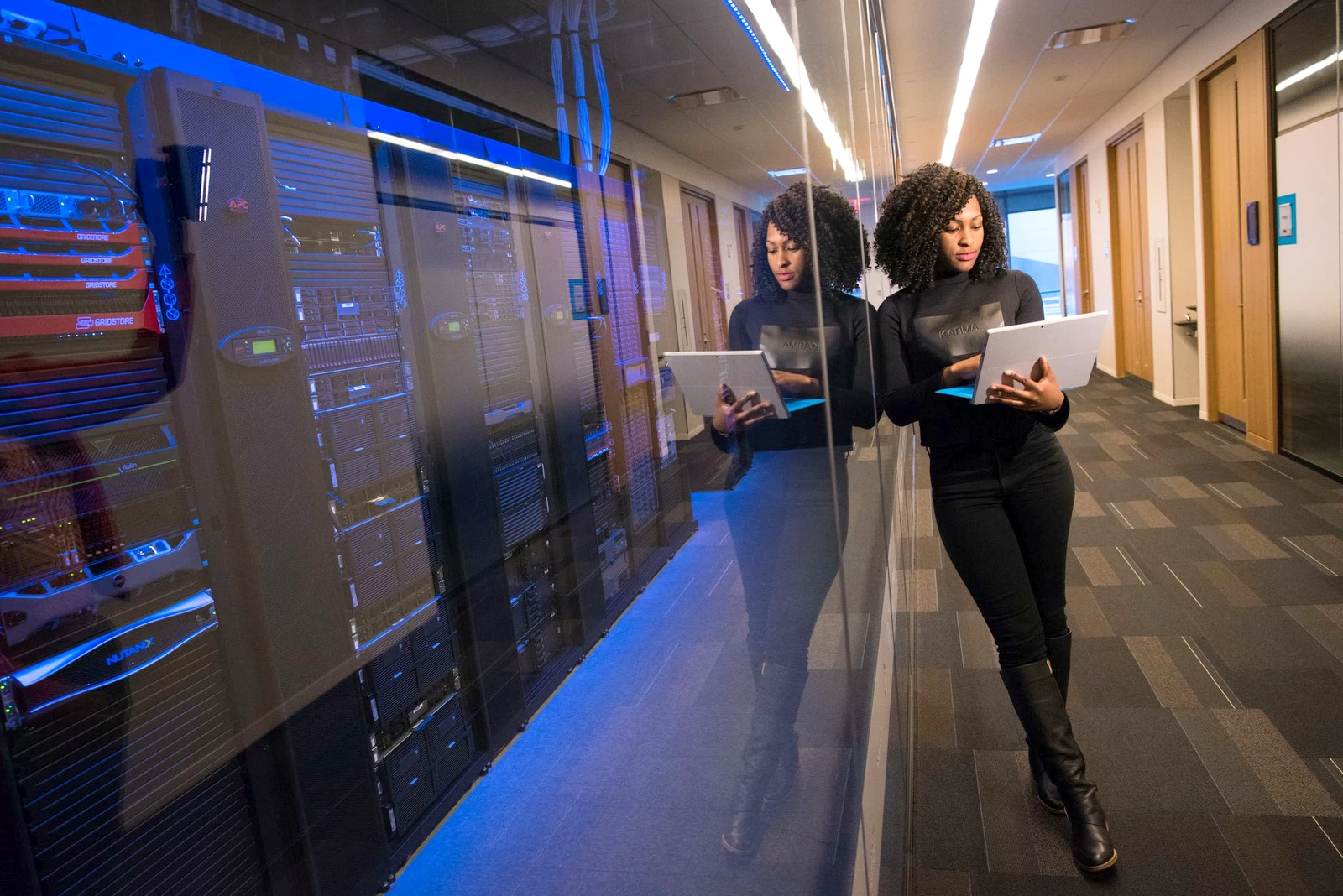 Two colleagues with a tablet in a data centre