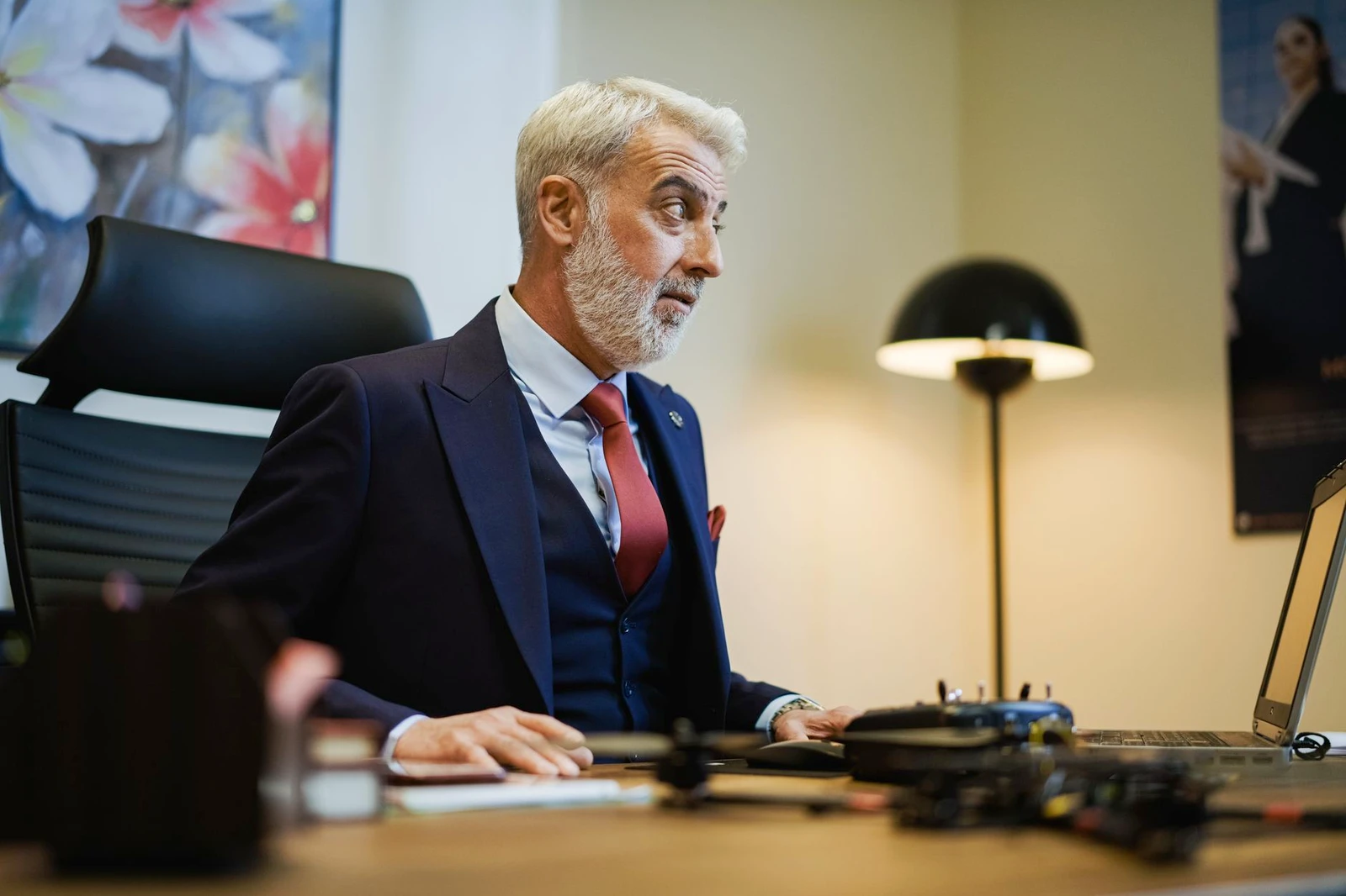 Senior executive working at his computer in a modern office