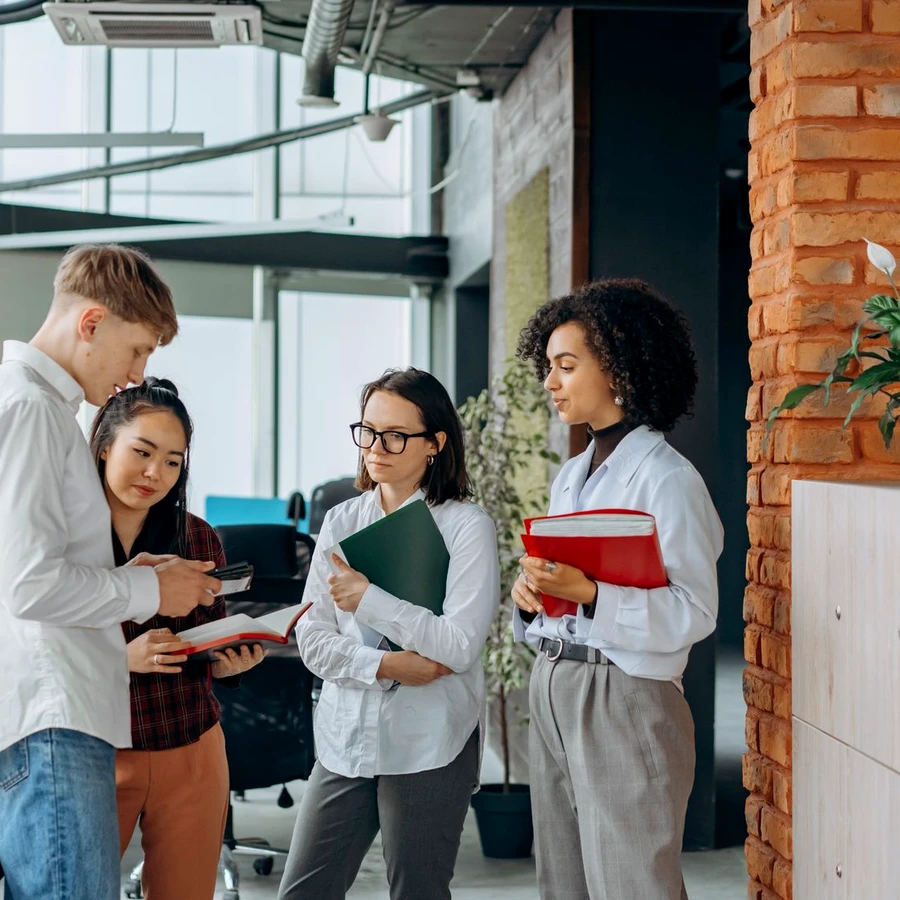 A team talking together in a bright office